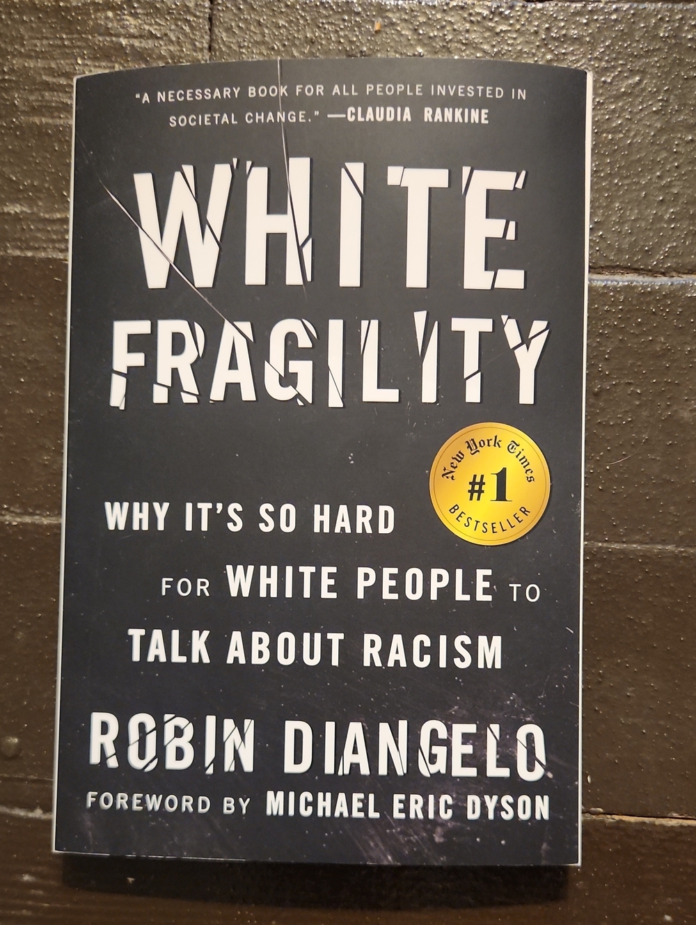 White Fragility by Robin DiAngelo - Black Cover with Yellow Accent